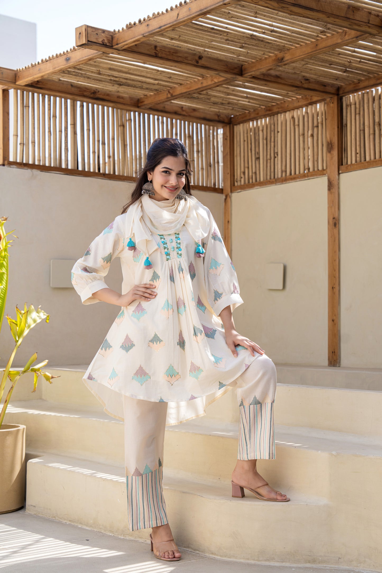 Pastel Geometric Printed A-Line Kurta Set With Embroidered Detailing and Dupatta
