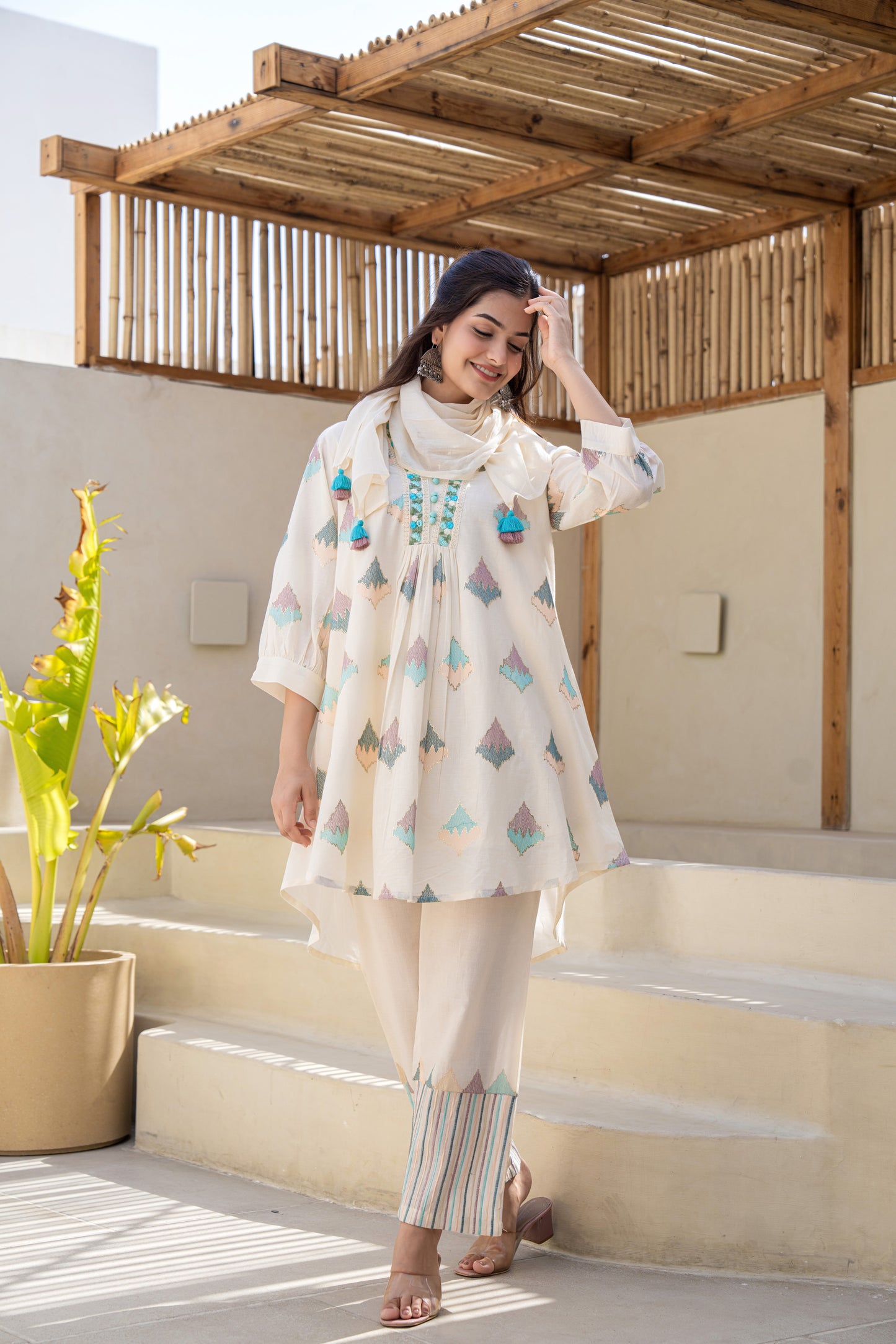 Pastel Geometric Printed A-Line Kurta Set With Embroidered Detailing and Dupatta