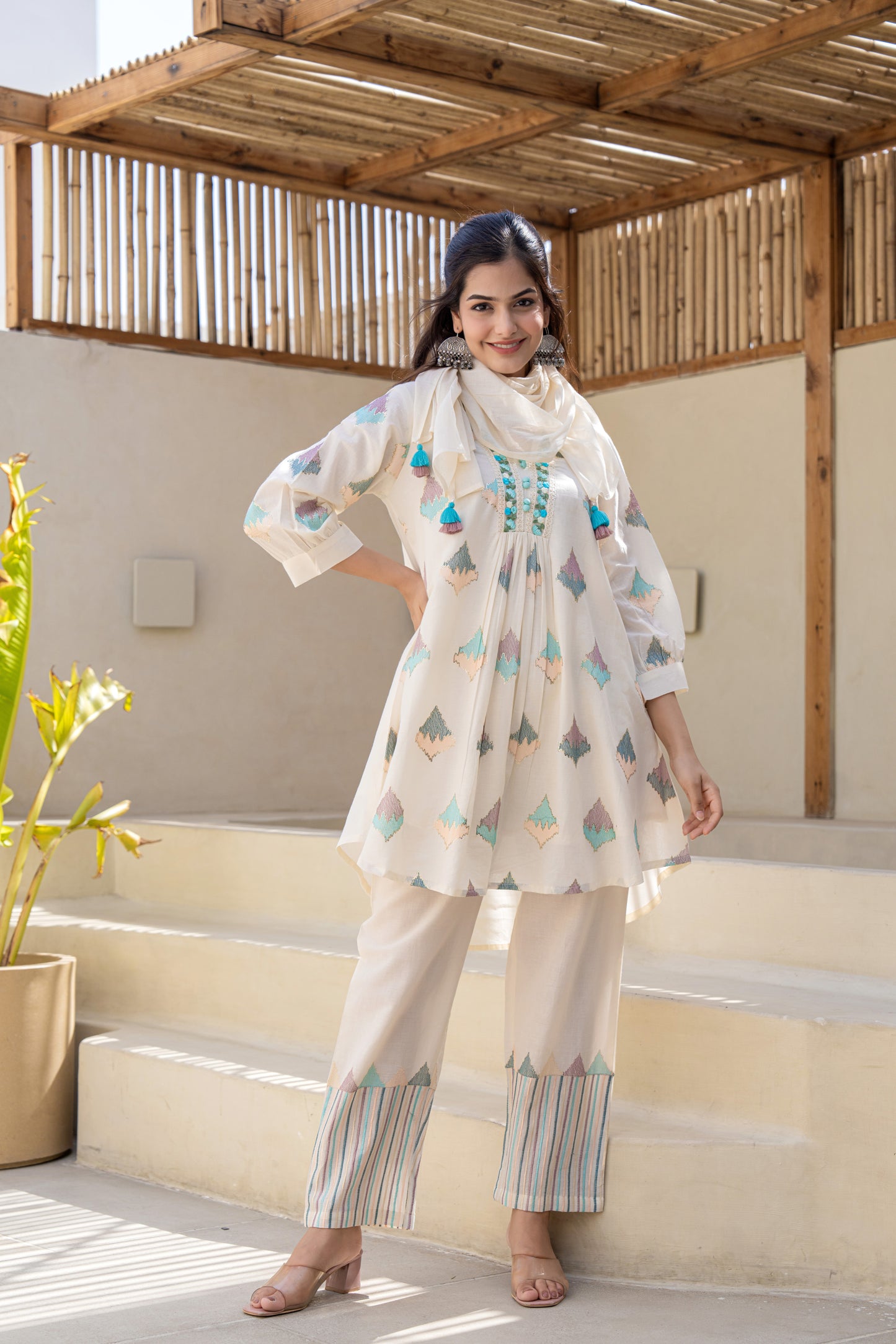 Pastel Geometric Printed A-Line Kurta Set With Embroidered Detailing and Dupatta