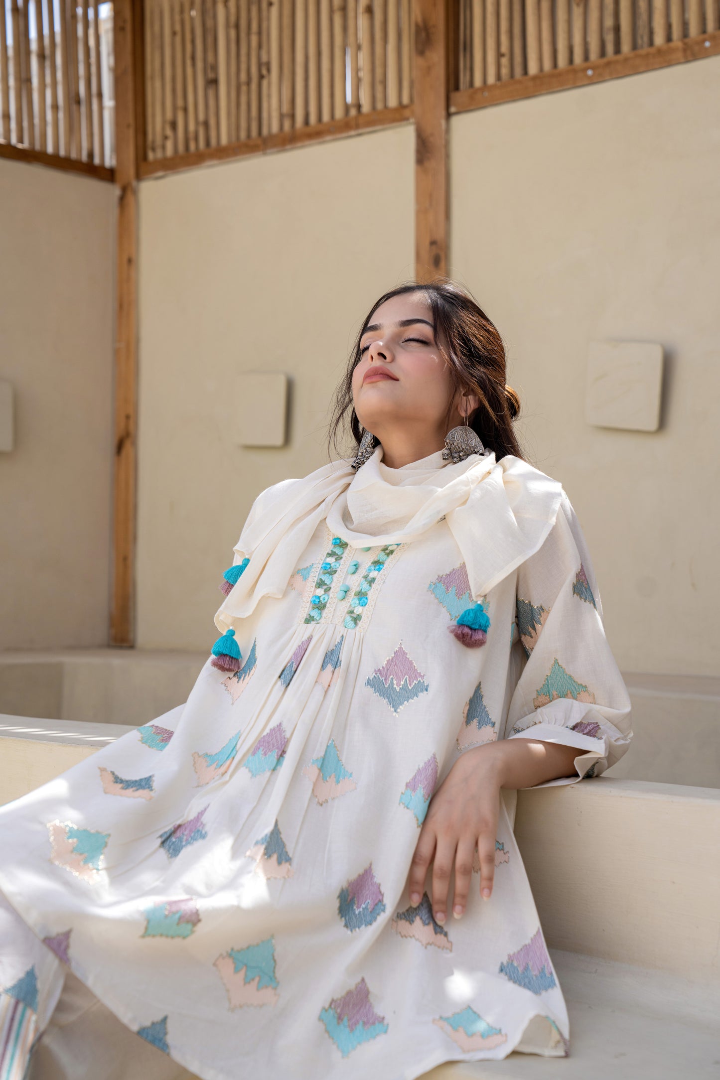Pastel Geometric Printed A-Line Kurta Set With Embroidered Detailing and Dupatta
