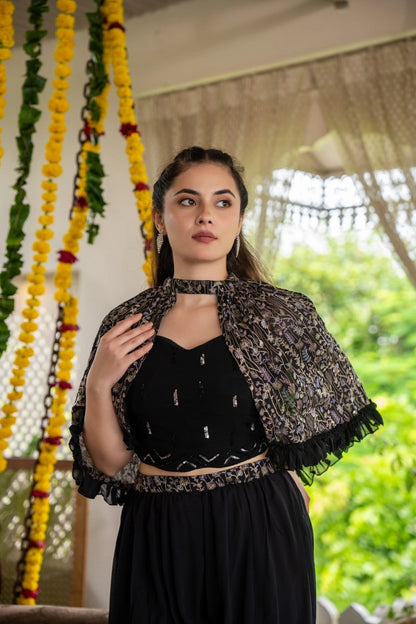 Close up of black muslin fabric and embellishment detail