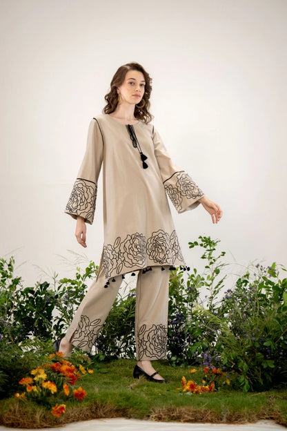 Close up of beige floral embroidery detail