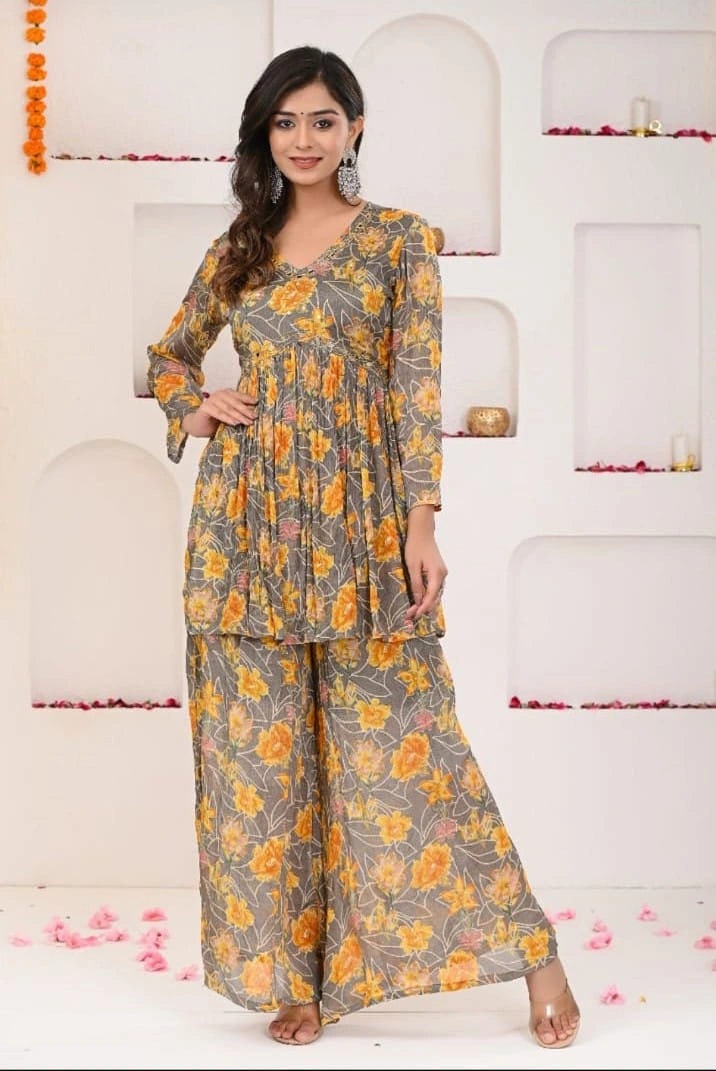 woman wearing shreenaya grey yellow chinon angrakha sharara set