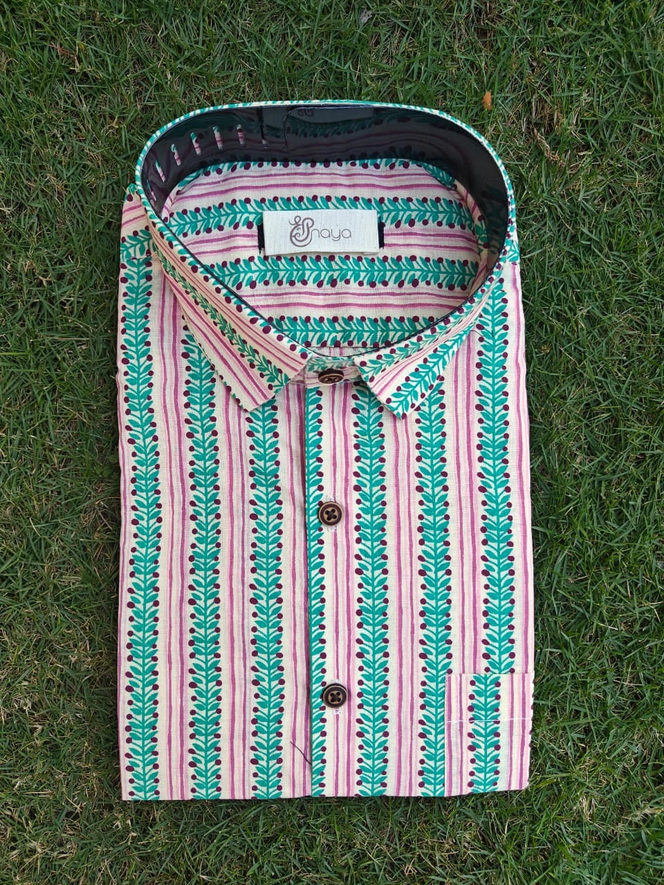 green pink print on casual shirt fabric