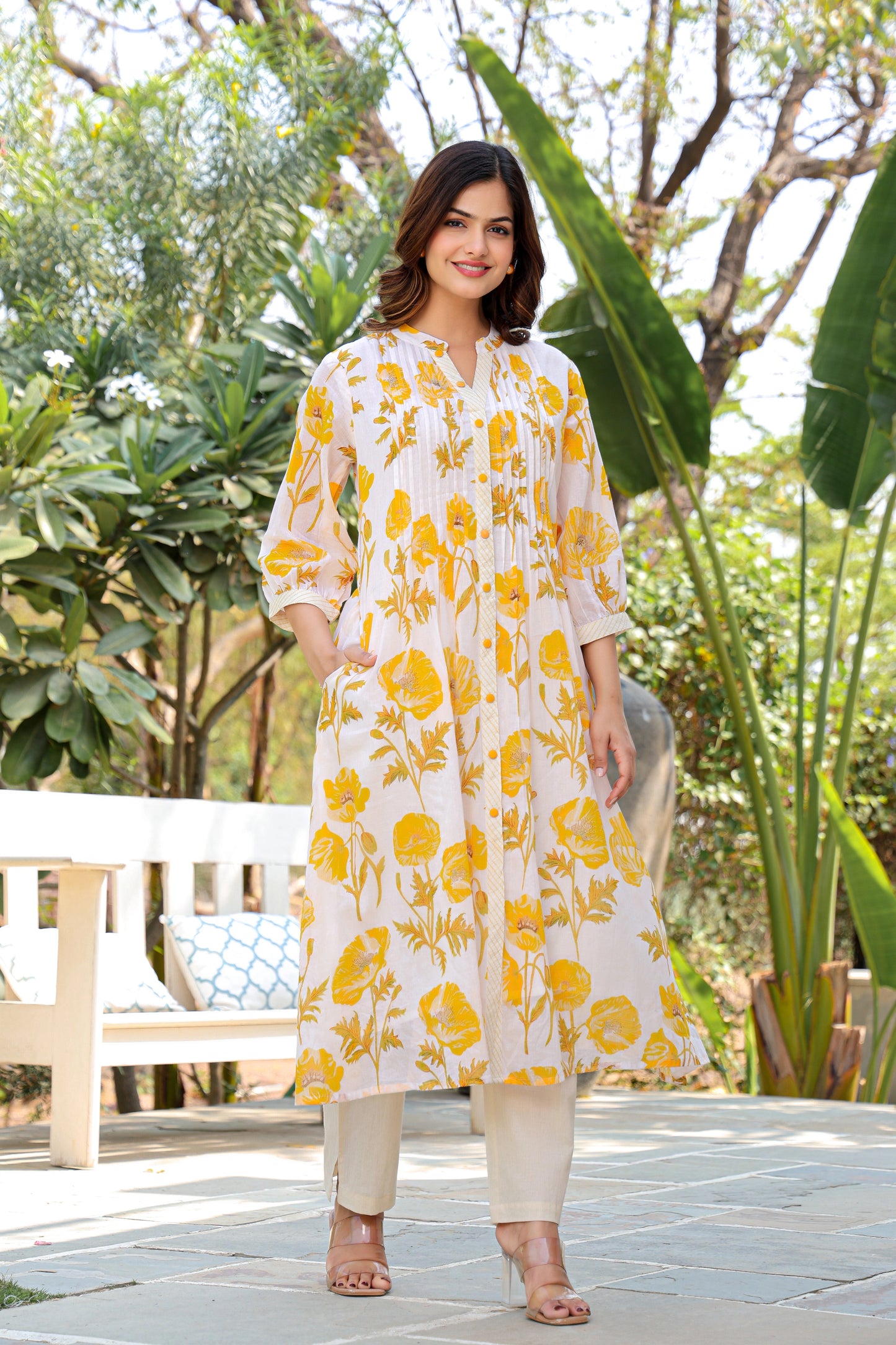 Model wearing white and yellow floral cotton co-ord set