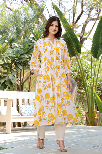 Model wearing white and yellow floral cotton co-ord set